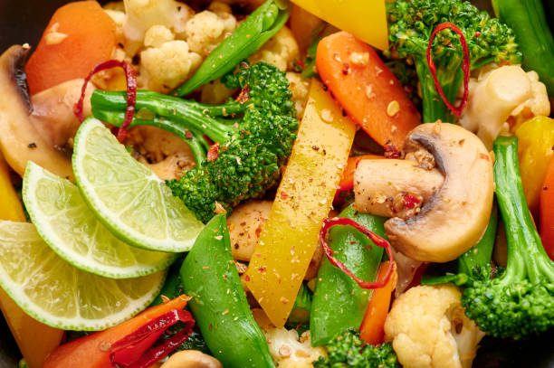 Pad Pak Ruam or Veg Thai Stir-Fried Vegetables close up texture. Pad Pak is thailand cuisine vegetarian dish with mix of vegetables and sauces. Thai Food.