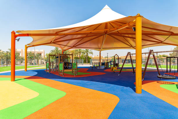 istock Small public parks placed next to the mosque completely shaded with rubber flooring equipped with the modern play structures 1223612842