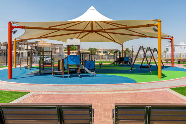 istock Small public parks placed next to the mosque completely shaded with rubber flooring equipped with the modern play structures 1223612947