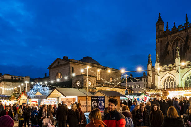 People at the Christmas market set up in Kingston Parade, at the foot of the Bath Abbey.