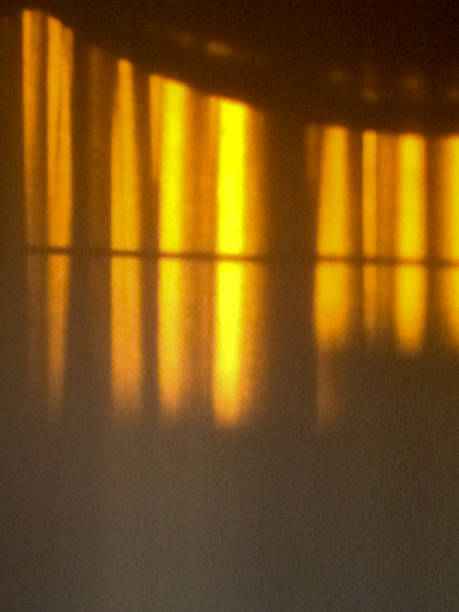 istock gold sunlight streams through curtains for golden design background 1223613956