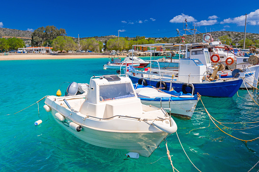 Blue lagoon of Marathi bay with fishing boats on Crete, Greece