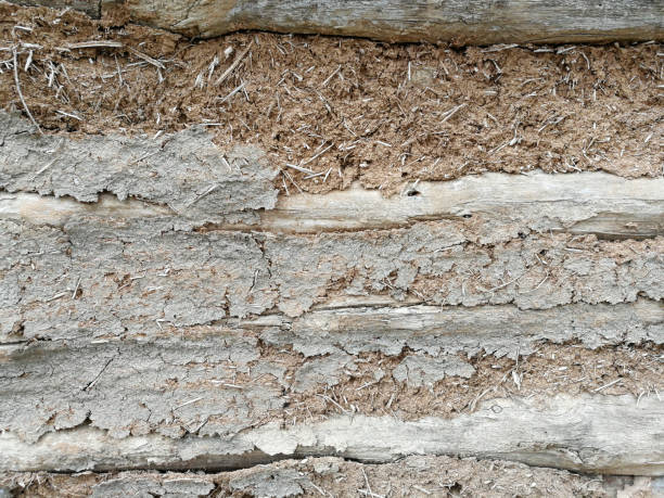 istock stone wall covered with clay plaster. Vintage architectural panoramic background 1223616116