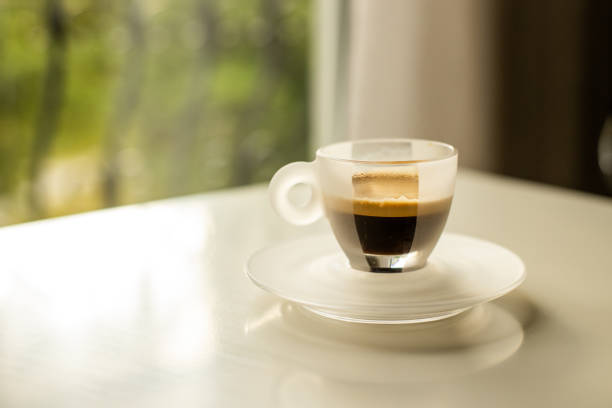Espresso in a glass cup shot on sunlight