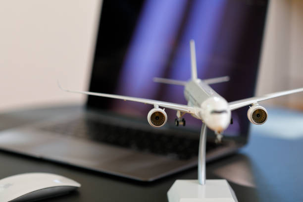 istock Airplane model in front of a Laptop 1223619223