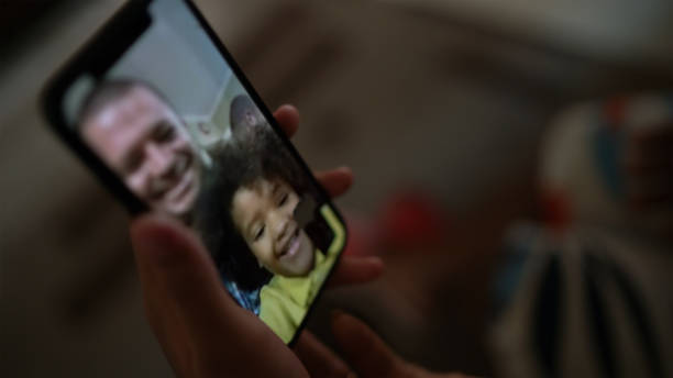 istock Mobile screen on a family video chat at home 1223619355