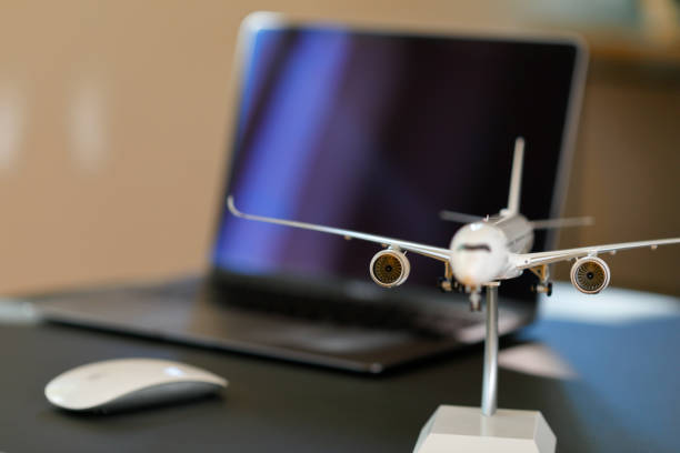 istock Airplane model in front of a Laptop 1223619423