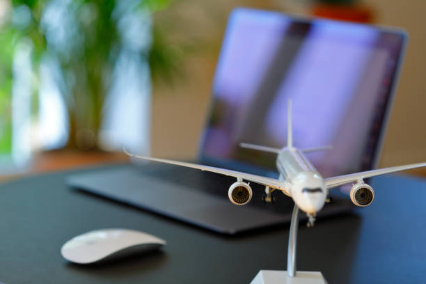 istock Airplane model in front of a Laptop 1223620363