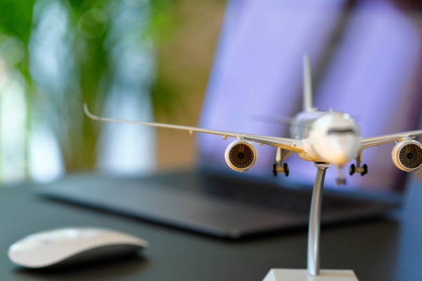 istock Airplane model in front of a Laptop 1223620519