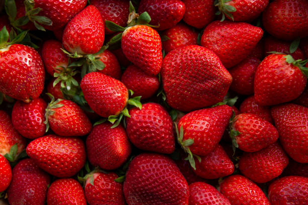 istock Organic red ripe strawberries background. 1223620653