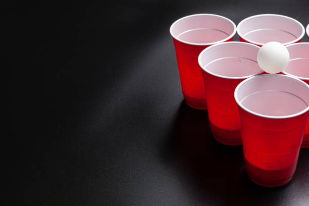 istock Beer pong college game on black background 1223621263