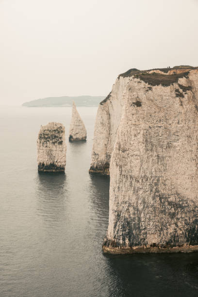 22 AUG 2025 - Isle of Wight, UK - A Sailing yacht sailing In Studland Bay and near to Old Harry Rocks
