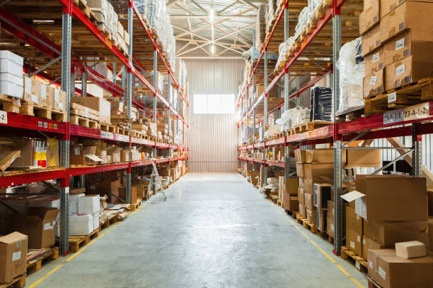 istock Modern warehouse shelves with pile of cardboard boxes 1223623743