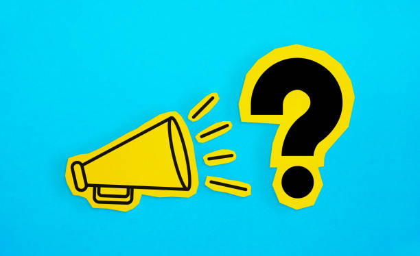 istock Megaphone drawing on the cut yellow paper makes “Question Mark” announcement. 1223624091