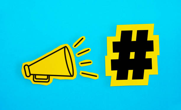 Megaphone drawing on the cut yellow paper makes “Hashtag icon” announcement.