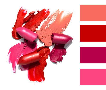 Creative concept photo of cosmetics swatches beauty products lipstick on white background.