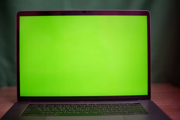 Close up laptop with green screen on table in work space concept. Close up laptop with green screen on table in work space concept. chroma key stock pictures, royalty-free photos & images