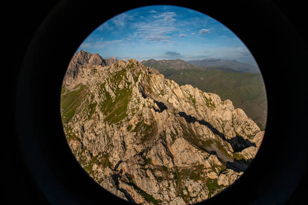 istock Huge mountain. Green mountainious terain. Scenic landscape. Cloudy sky. View through a monocular. 1223628596