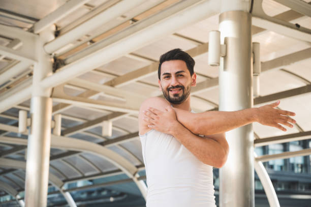 istock Young man runner stretching for warming up before running or working out 1223631127