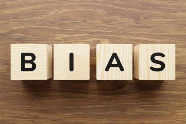 Photo of Cubes with letters form the word bias.