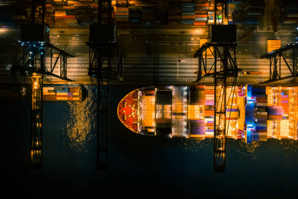 istock Cargo Ship Containers Shipment Seaport Top View Drone Aerial View at Night 1223633395