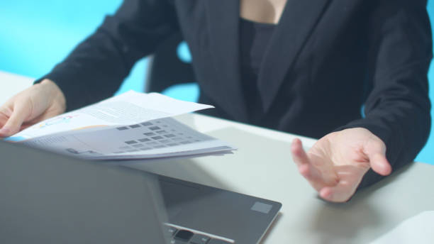 istock Documents were thrown onto the desk of a worker 1223633618