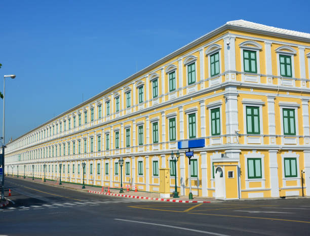 istock Yellow building with green windows in Bangkok 1223635420