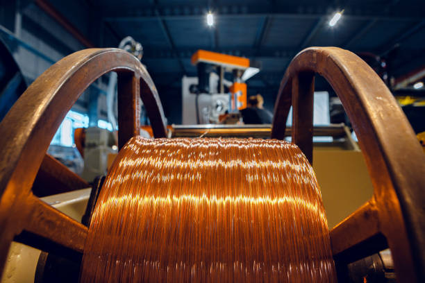 Production of copper wire, cable in reels at factory. Cable factory. Production of copper wire, cable in reels at factory. Cable factory. Close up. copper cable stock pictures, royalty-free photos & images