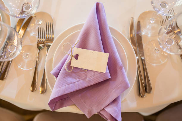 Beautiful venue decorated by flowers. Name cards
