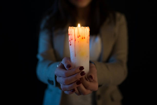 istock girl with a candle mystical photo 1223639687