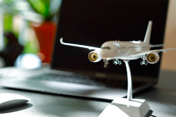 istock Airplane model in front of a Laptop 1223642289