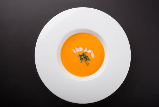istock Orange pumpkin soup with prawns 1223644052