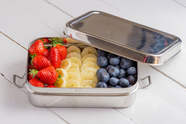 Blueberries, bananas and strawberries in plastic free container
