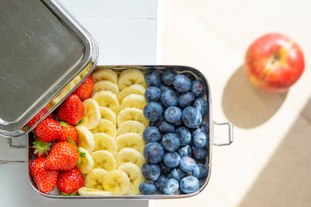 istock Blueberries, bananas and strawberries in plastic free container 1223646917