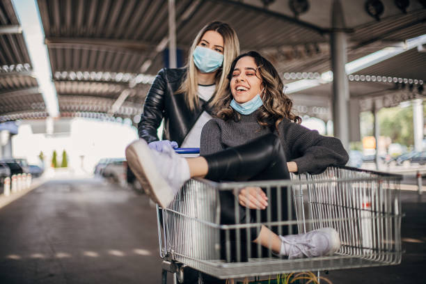 istock Happy women having fun in shopping after coronavirus lockdown 1223647680