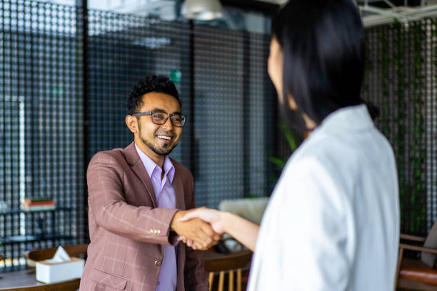 istock Asian Malay business man exchanging a business handshake. 1223648620