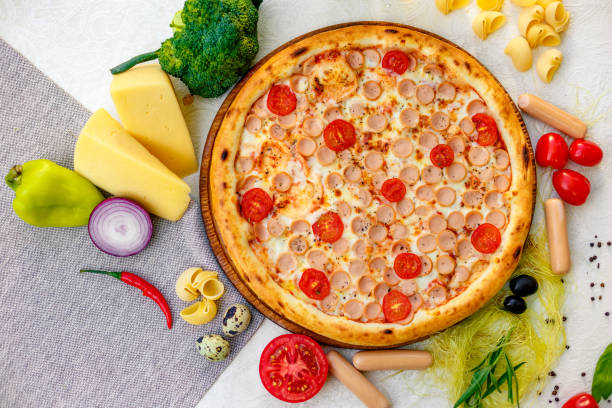 istock Delicious italian pizza served on table with ingredients cheese and vegetables 1223648782