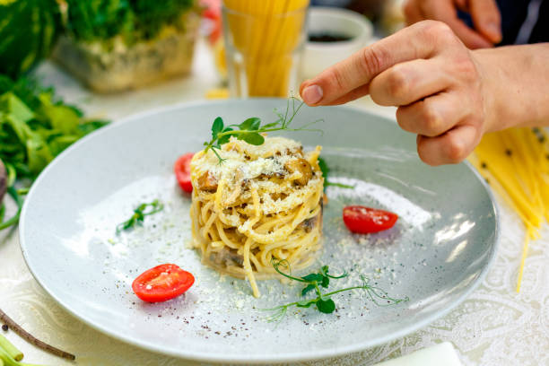 istock Italian pasta carbonara served on a table with ingredients 1223648956