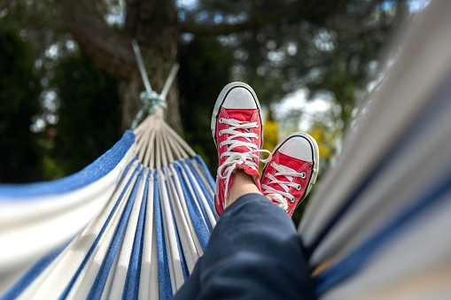 Chilling in hammock hung on  the tree