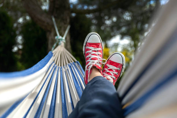 Chilling in hammock Chilling in hammock hung on  the tree pair of shoes stock pictures, royalty-free photos & images