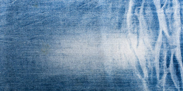istock Blue denim jeans texture banner with copy space for text design background. Canvas denim fashion texture 1223650432