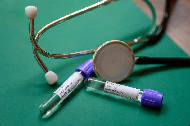 istock Coronavirus vaccine and stethoscope on doctor’s table 1223650688