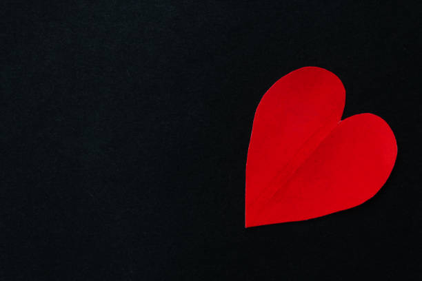 istock Paper heart against the black background 1223650851