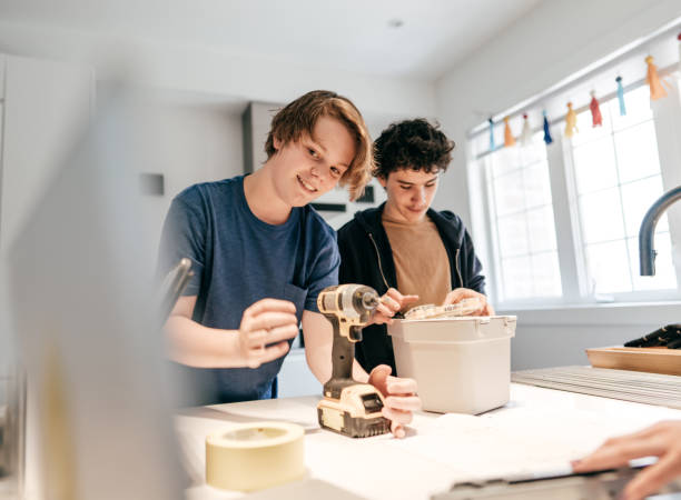 istock Teens assembling the small furniture at home 1223650932