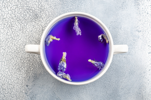 Butterfly pea flower blue tea. Healthy detox herbal drink on light background