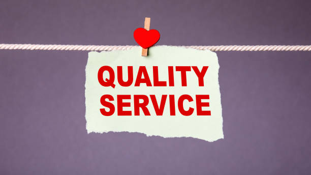 istock QUALITY SERVICE concept. Sheet attached with peg on the rope 1223653392