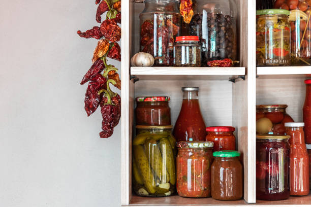 istock Homemade vegetables in cans on shelves 1223654217