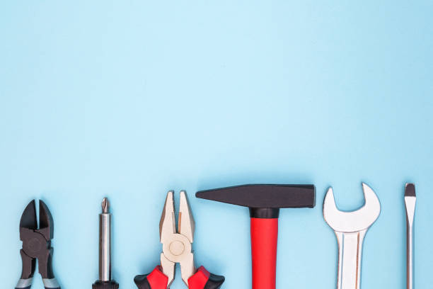 istock Various tools worker, hammer, wrench, screwdriver, pliers on a blue background, top view with free space 1223656831