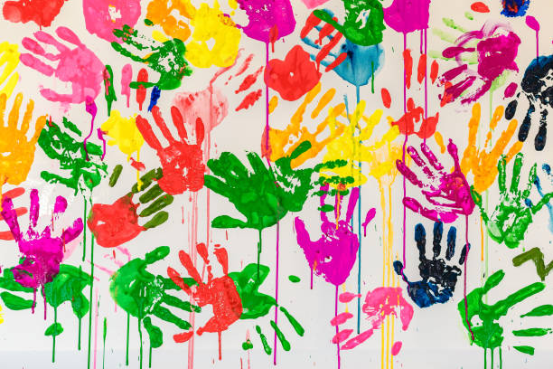 istock Colorful painted hand prints on white background 1223657033