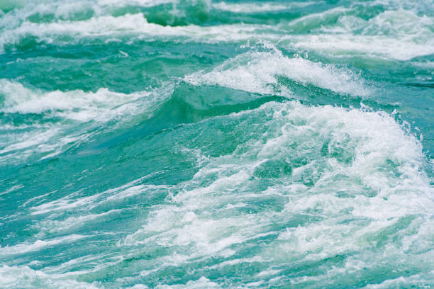 istock Blue ocean waves, tide. Swift current of river 1223657036